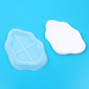 Detail view of a cloud-shaped silicone mold with its finished white tray product
