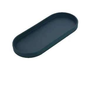 Dark green oval silicone tray for jewelry storage and bathroom organization