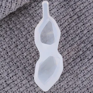 Detail of translucent silicone mold with double diamond-shaped resin cavities