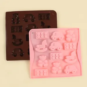Dos moldes de silicona con temática animal en rosa y marrón para dulces y bombones