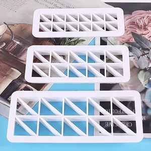 Detailed view of 3pcs white geometric triangle cookie cutter set for baking