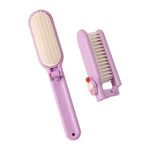 Cute purple foldable mini hair brush with a cupcake charm for portable travel use