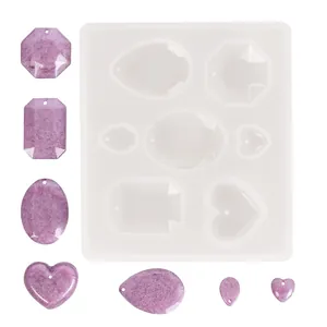 Moule en silicone pour pendentifs en résine DIY aux formes de cœur et géométriques.