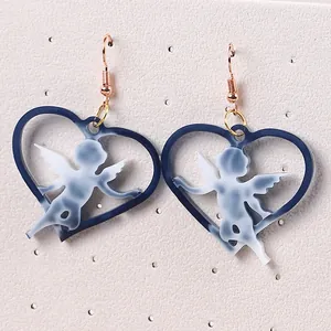Creative heart-shaped Cupid angel drop earrings with blue marbled acrylic design