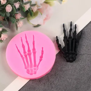 Detail of pink skeleton hand silicone mold for Halloween cake decorating and DIY crafts