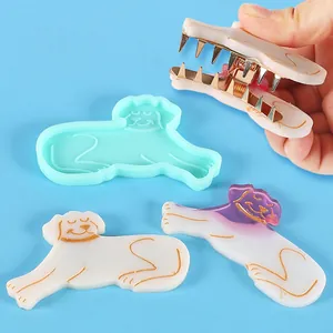 Detailed view of dog-shaped silicone mold and finished handmade acrylic hair clips for DIY jewelry