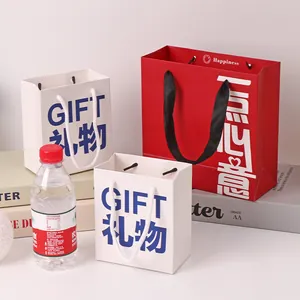 Minimalist red and white paper gift bags with handles for birthdays and souvenir packaging