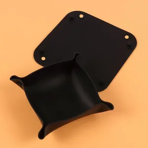 Minimalist black silicone desk organizer tray showing folded form and flat base detail