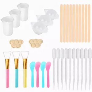 Comprehensive DIY epoxy resin tool kit with silicone cups, stir sticks, and pipettes