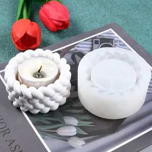 Detailed view of woven texture silicone mold and a finished white candle holder