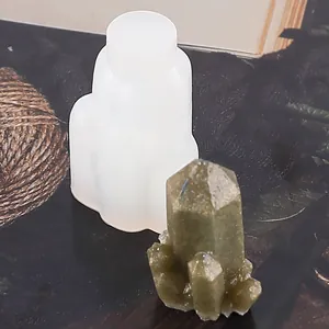 Close-up of crystal cluster silicone mold and finished green resin piece