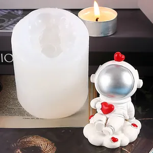 Detailed view of astronaut silicone mold for DIY crafts showing the finished resin figurine