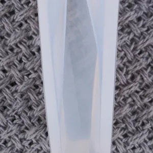 Close-up view of a translucent silicone mold for DIY diamond pendant jewelry making