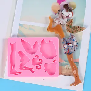 Detail of pink silicone fairy figure mold with colorful finished resin angel sample