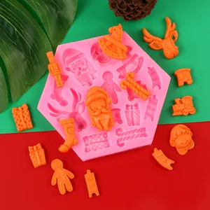 Detailed view of pink Christmas silicone mold showing finished Santa and reindeer shapes.