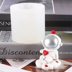 Detailed view of white silicone astronaut mold with a finished resin craft figure