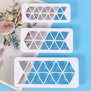 Three pieces set of white plastic triangular geometric pattern cutters for cookie baking