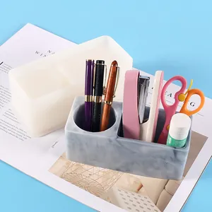 Macro view of DIY resin pen holder silicone mold and finished marble storage box