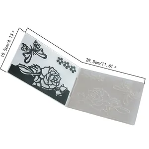 Detailed view of fondant embossing folder with rose and butterfly patterns and dimensions