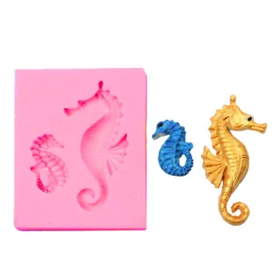 Pink silicone mold featuring two seahorse sizes shown with blue and gold resin results