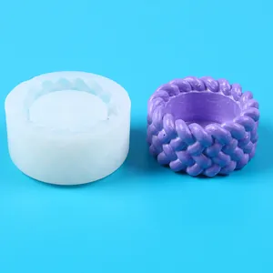 Woven pattern silicone mold with finished purple succulent pot on blue background