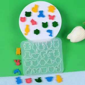 Detailed view of the silicone mold for mini animal earrings and colorful resin finished pieces