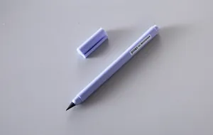 Detail view of the purple inkless everlasting pencil with a black graphite tip.
