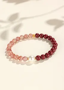 Close-up of new Chinese style bracelet with red cinnabar, agate beads and white shell pearl