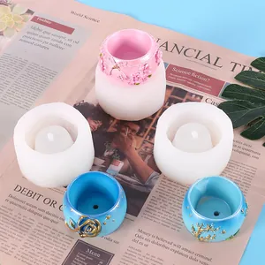 Detailed view of DIY succulent plant pot silicone molds and finished floral resin pots