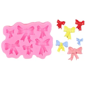 Juego de moldes de silicona rosa con forma de lazo para decoración de pasteles y fondant
