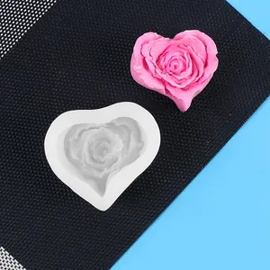 Detailed view of heart-shaped rose silicone mold with a finished pink soap sample