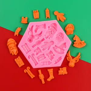 Detail view of pink Christmas silicone mold with Santa, reindeer and gingerbread man