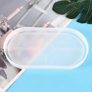 Detailed macro view of a translucent oval silicone mold for DIY resin tray and coaster making