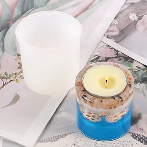 Detailed view of translucent cylindrical silicone mold for DIY resin candle holders with sample