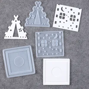 Close-up of DIY Christmas house candle holder silicone molds showing fine star and moon details