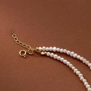 Detail of vintage freshwater rice pearl necklace with adjustable gold-plated clasp