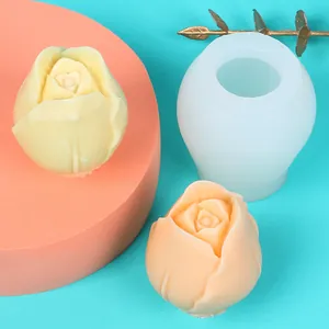 Close-up detail of a tulip shaped silicone mold alongside realistic DIY flower candle finishes
