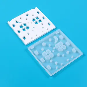 Detailed view of silicone mold and finished star-moon house decorative piece
