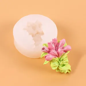 Detailed view of flower silicone mold and finished pink floral plaster sculpture.
