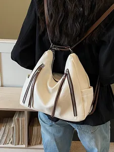 Stylish cream faux leather slouchy backpack for women featuring contrast brown strap accents