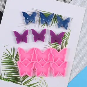 Stampo in silicone a forma di farfalla per gioielli in resina con campioni finiti
