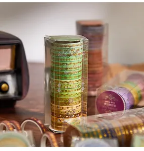 Premium set of twenty decorative washi tape rolls featuring elegant gold foil patterns