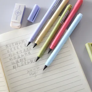 Colorful macaron eternal inkless pencils on a notebook for art and writing