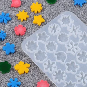 Close-up detail of a translucent silicone mold for DIY snowflake and star jewelry