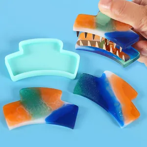 Detail view showing the DIY silicone mold and finished colo r ful resin hair clip pie ce s.