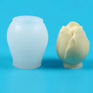 Detail of tulip-shaped silicone mold beside a finished flower candle
