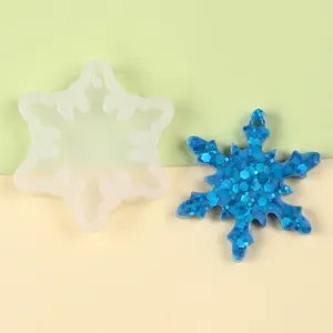 Detail of snowflake silicone mold with a glittery blue resin snowflake decoration