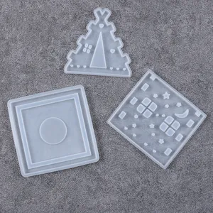 Macro view of three silicone molds for DIY Christmas cabin aromatherapy candle holders