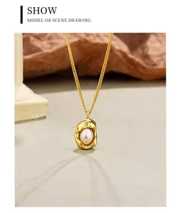 Detail showing the irregular gold-textured pendant with a lustrous white pearl center.