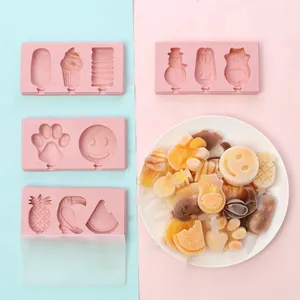 Detailed view of pink silicone popsicle molds with various cartoon shapes and results.